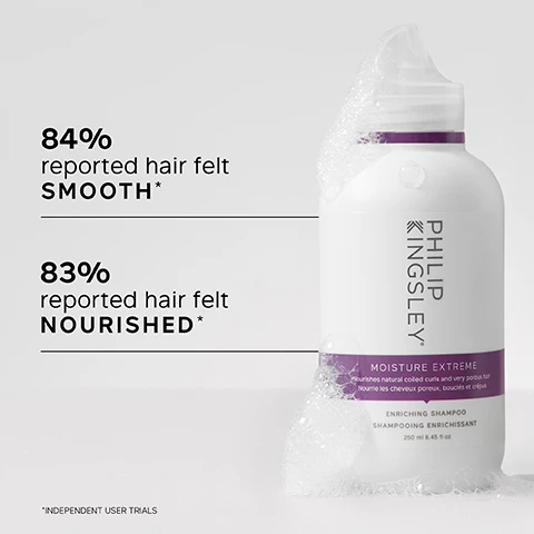 Image 1 - A bottle of Philip Kingsley Moisture Extreme Enriching Shampoo is shown with bubbles on the side, displaying the text 84% reported hair felt SMOOTH* and 83% reported hair felt NOURISHED*.
Image 2 - A hand holding a bottle of Philip Kingsley Moisture Extreme shampoo, with visible text listing key benefits: Rich, hydrating formula; Cleanses, conditions and detangles; Suitable for natural, relaxed or synthetic hair; Tames even the toughest frizz.
Image 3 - A woman with curly hair holds a bottle of shampoo and smiles, alongside text that reads The only shampoo my porous dry hair likes. GREAT SLIP... Doesn’t dry out your hair and left my crunchy ends HYDRATED! CUSTOMER REVIEW.
Image 4 - A white shampoo bottle with a purple label, labeled PHILIP KINGSLEY MOISTURE EXTREME, featuring a description of key ingredients: Sugarcane-derived Quat, Guar, and Sodium C, with corresponding benefits for hair.
Image 5 - Split image showing a person with curly hair on the left labeled BEFORE with frizz, and on the right labeled AFTER with smoother, well-defined curls.
Image 6 - A person with curly hair washes their hair with shampoo, while text beside them advises to wet hair and lather well with a gentle kneading of the scalp for 60 seconds and to rinse well.
