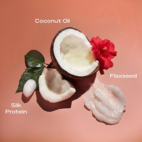 Image 1 - A halved coconut is shown with white flesh and a pink background, surrounded by green leaves, a red flower, and with text labeling coconut oil, flaxseed, and silk protein.
Image 2 - A vibrant red hibiscus flower next to coconut pieces is set against a light pink background, with the text COCONUT OIL HIBISCUS FLOWER SHEA BUTTER displayed prominently above.