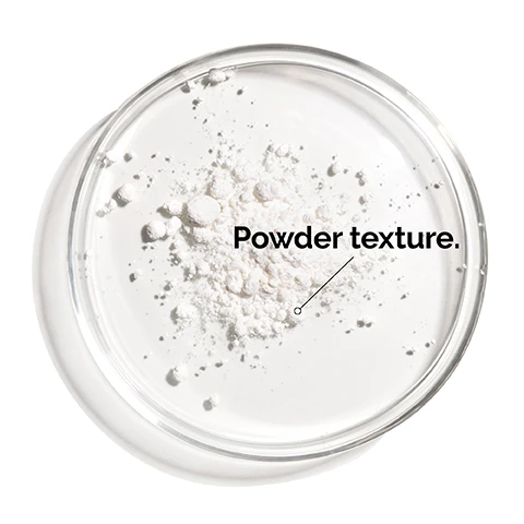 Image 1 - A clear glass dish contains white powder with the text Powder texture. below it.
Image 2 - A person applying a cream to their face with highlighted text reading Powdered form of direct vitamin C reduces signs of aging by brightening and balancing uneven skin tone. Apply to the face once daily, ideally in the evening.
Image 3 - A jar of The Ordinary L-Ascorbic Acid Powder sits on a textured surface surrounded by broken white powder, with the text A customizable concentration of vitamin C to address uneven skin tone.
Image 4 - A person is holding a dropper above their palm, dispensing a clear liquid while text next to the image states Mix a small amount with other products, and labels indicate Hyaluronic Acid 2% + B5 and 100% L-Ascorbic Acid Powder.