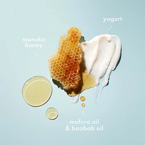 Image 1 - A honeycomb piece is displayed alongside dollops of yogurt, light and dark oils, with labels indicating each ingredient: manuka honey, yogurt, and mafura oil & baobab oil.
Image 2 - A blue background features the text FOR EXTREMELY DRY & BRITTLE HAIR in various font styles and sizes.