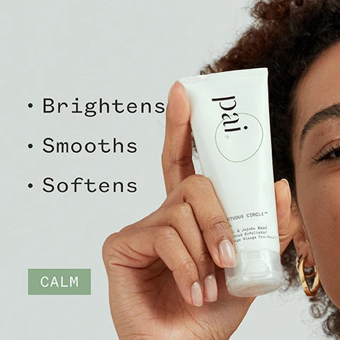 Image 1 - A person with curly hair holds a tube of skin care product labeled pai in their right hand, with bullet points to the left reading Brightens, Smooths, Softens, and a green box at the bottom that says CALM.
Image 2 - A skincare product tube labeled prai with the text describing its gentle exfoliation benefits, along with visible logos indicating organic and vegan certifications, and the quote attributed to Milly H.