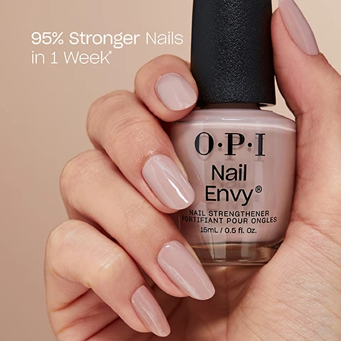 Image 1 - A hand with light pink-beige manicured nails holds a bottle of OPI Nail Envy nail strengthener of the same color, with visible text reading 95% Stronger Nails in 1 Week* and on the bottle OPI Nail Envy Nail Strengthener FORTIFIANT POUR ONGLES 15ml / 0.5 fl. Oz. Image 2 - A red OPI Nail Envy nail strengthener bottle stands next to a hand with red painted nails, with text reading Apply 2 coats then 1 coat daily for 6 days. OPI Nail Envy. NAIL STRENGTHENER FORTIFIANT POUR ONGLES 15 mL / 0.5 Fl. Oz. Pro Tip! Use Nail Envy® Nail Strengthener as your base coat for dark shades.