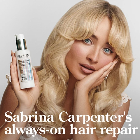 Image 1 - Image shows a woman with long, wavy blonde hair holding a bottle of Redken hair product and looking directly at the camera; visible text includes Sabrina Carpenters always-on hair repair.
Image 2 - Image of a bottle of Redkens 24/7 Bond Repair Overnight Treatment on a two-toned background, featuring text that reads 24/7 BOND REPAIR OVERNIGHT TREATMENT, UP TO 89% LESS BREAKAGE*, UP TO 3X SOFTER*, along with additional details about the product including its ingredients and intended use for damaged hair.
Image 3 - A side-by-side comparison of a woman with curly hair showing the left side labeled BEFORE and the right side labeled AFTER, with visible text below the right image stating *AFTER ACIDIC BONDING CONCENTRATE SHAMPOO, CONDITIONER, AND 24/7 SERUM.
Image 4 - Image shows a comparison of hair before and after treatment, with the left side labeled BEFORE displaying frizzy, unkempt blonde hair, and the right side labeled AFTER* showing smooth, shiny, well-groomed blonde hair, accompanied by visible text stating *AFTER ACIDIC BONDING CONCENTRATE SHAMPOO, CONDITIONER, AND 24/7 SERUM.
Image 5 - A smooth, flowing background with visible text stating that the product is formulated with citric acid, polyglutamic acid, and squalane, which magnetizes the hair to prevent breakage.
Image 6 - A graphic featuring a light gray background and a geometric illustration on the right, with the text that reads CITRIC ACID PENETRATES 7 LAYERS DEEP & STRENGTHENS HAIR* at the center and additional text stating *CONTINUED USE OF SYSTEM OF ABC SHAMPOO, CONDITIONER, AND SERUM VS. UNTREATED HAIR at the bottom.
Image 7 - A person with curly hair in a black shirt holds a hand containing cream from a bottle labeled Redken, with visible text that reads START WITH 2 PUMPS, ADD MORE AS NEEDED REAPPLY NIGHT AND DAY AS DESIRED.
Image 8 - A person with curly hair is shown in two images, one on the left with damp hair and the other on the right with dry hair, both applying a product to their hair with visible text that reads APPLY TO MID-LENGTHS & ENDS ON DAMP OR DRY HAIR.
Image 9 - Three hair care products are displayed on a white surface with sunlight casting shadows, labeled with the text STRENGTH REPAIR ROUTINE, which includes SHAMPOO, CONDITION, and OVERNIGHT LEAVE-IN.