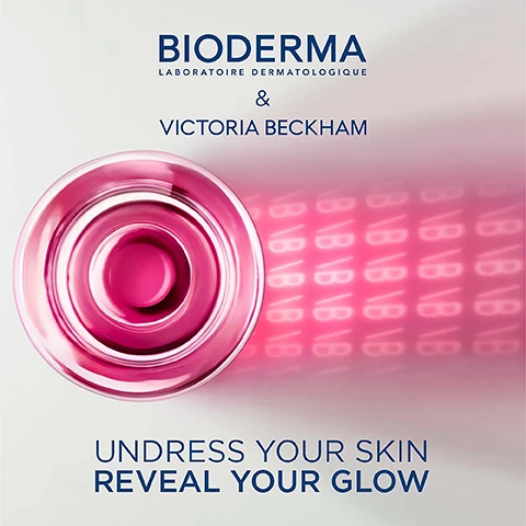 Image 1 - Image showing a top-down view of a pink skincare product with circular design, accompanied by text that reads BIODERMA, LABORATOIRE DERMATOLOGIQUE, & VICTORIA BECKHAM, and the phrases UNDRESS YOUR SKIN REVEAL YOUR GLOW.
Image 2 - A close-up of a woman’s face displaying smooth skin with visible brown eyes, showing the text 98% Reveals the skin radiance* below her chin, with additional small text mentioning a clinical study.
Image 3 - A woman with long brown hair, wearing a black top and gold hoop earrings, is holding a pink bottle of Bioderma skincare product close to her ear, with the text BIODERMA LABORATOIRE DERMATOLOGIQUE & VICTORIA BECKHAM displayed prominently above her.
Image 4 - A transparent bottle labeled Bioderma & Victoria Beckham contains a pink liquid, with the words Sensibio H2O and Limited Edition visible on the label and a shadow of the bottles logo displayed on a light surface.
Image 5 - A smiling woman with long brown hair is wearing a white top, and the image includes text that reads: DR. ALEXIS GRANITE DERMATOLOGIST Sensibio H2O does not need to be rinsed-off: its minimalist biomimetic formula at physiological pH provides a high cleansing efficacy while respecting the skin barrier.