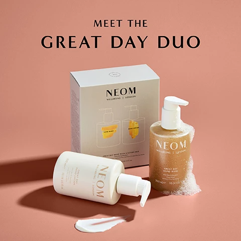 Image 1 - A white bottle of hand lotion and a golden bottle of hand wash are displayed next to their box labeled NEOM, with the text MEET THE GREAT DAY DUO prominently featured above.
Image 2 - Image of two NEOM skincare products, a hand wash and a hand lotion, placed on a soft pink background, with the text stating 86% said the fragrance instantly boosted their mood and an asterisk noting an independent blind study on 68 people, after 2 weeks.
Image 3 - A bottle of NEOM Great Day Hand Wash in a gold container with a white pump sits against a pink background, featuring text about its uplifting ingredients and benefits.
Image 4 - A person is holding a cream-colored hand lotion bottle labeled NEOM WELLBEING LONDON GREAT DAY HAND LOTION, with text on the left indicating the bottle is 100% recyclable and contains 100% natural fragrances.