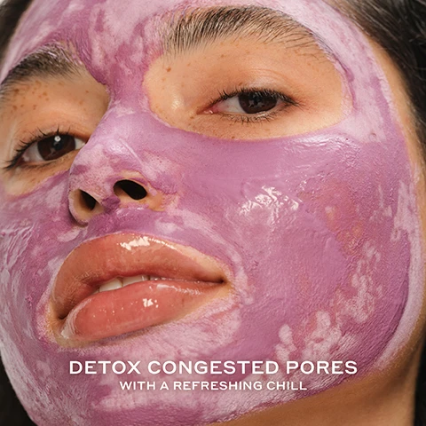 Image 2 - A close-up of a person wearing a purple facial mask, with visible freckles and a glossy finish on the skin, accompanied by the text DETOX CONGESTED PORES WITH A REFRESHING CHILL.
Image 3 - A hand holds a green tube of face mask with a purple product visible at the top, featuring text stating that 95% agree it instantly clears congested pores, 100% agree it leaves skin looking less oily for a healthy glow, and 97% agree it clears blackheads and extracts impurities, with a note about an 8-week clinical study of 37 people.
Image 4 - A creamy, lilac-colored skincare product is shown with labels identifying its key ingredients including salicylic acid, kaolin and purple clay, Danish purple willow ferment, and betaine salicylate, along with their benefits.
Image 5 - Close-up of creamy purple clay mask with a textured surface and visible text reading Whipped Purple Clay Mask with a refreshing chill.
Image 6 - Image shows a grouping of four skincare products from OLEHENRIKSEN arranged with bubbles on a light background, with visible text stating YOUR ACNE ROUTINE, along with descriptions for each product: 01 / CLEANSE DAILY D-CLOG CLEANSER Instantly reduces the appearance of pores, 02 / EXTRACT IMPURITIES COLD PLUNGE PORE MASK Clears congested pores, 03 / TREAT BLEMISHES DETOX DROPS TONER Improves blemishes in just 1 week, and 04 / HYDRATE STRENGTH MOISTURIZER 2x hydration instantly.