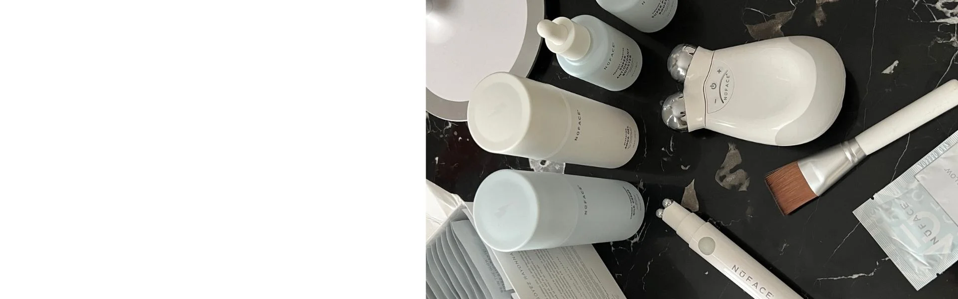 Hautpflegeprodukte und Geräte von NuFACE auf einem Tisch